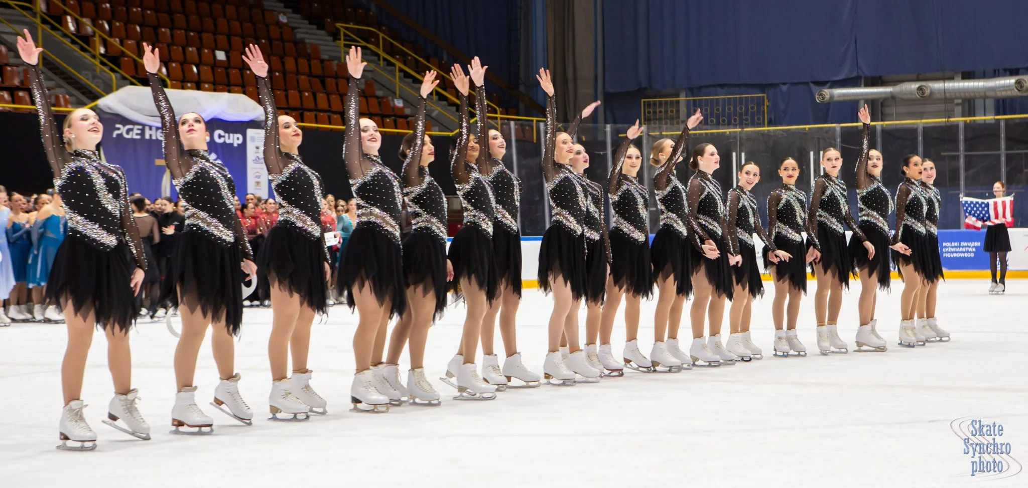 Crystallettes skaters taking their bow together on competition ice